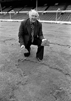 Grass Prints: Wembley groundsman Don Gallacher inspects the damage cause by the Scottish fans following