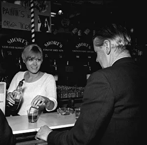 Square Prints: Wendy Richard May 1966 Actress Model aged 19 years old serving behind bar near