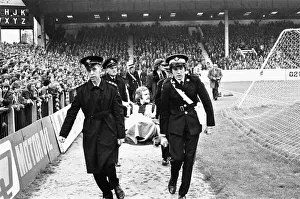 Injury Prints: West Broms Alistair Robertson is stretchered off during the local derby match