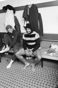 West Bromwich Albion Player, Cyrille Regis wearing fancy dress costume in dressing room