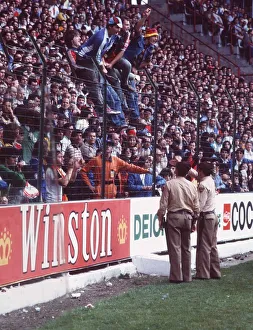 West Germany v Chile fans World Cup 1982 football supporters standing on fence police