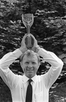 00240 Prints: West Ham and England Footballer Bobby Moore with the the old Jules Rimet World Cup