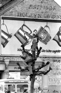 West Ham fans try to get a good view above the crowds during the West Ham victory parade