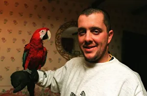 West Ham football player Julian Dicks at home with his pet parrot