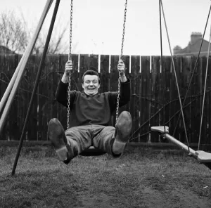 Swing Prints: West Ham footballer Johnny Byrne celebrates his England call up with a swing in the back