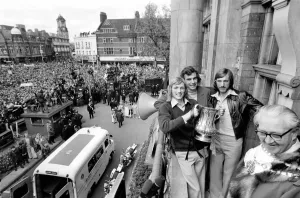 West Ham players Alan Taylor, Trevor Brooking and captain Billy Bonds show off the trophy