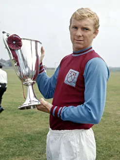 West Ham United captain Bobby Moore holds the European Cup Winners Cup trophy