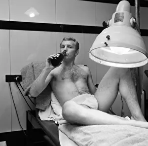 West Ham United captain Bobby Moore spending a few quiet minutes under the sun lamp with