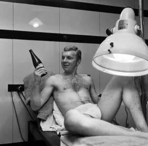 00795 Prints: West Ham United captain Bobby Moore spending a few quiet minutes under the sun lamp with