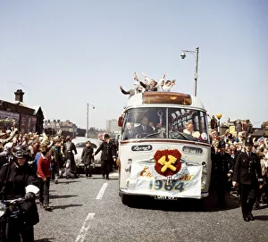 Parades Prints: West Ham United captain holds aloft the FA Cup from an open top double decker bus as