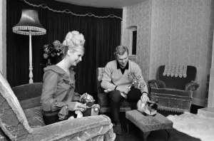 00808 Prints: West Ham United and England footballer Bobby Moore pictured at home with his wife Tina