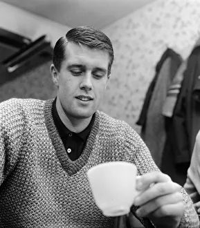 01232 Prints: West Ham United footballer Geoff Hurst looks at the tea leaves for a prediction of his