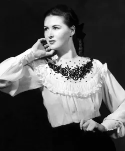 A white crepe Georgette blouse with a striking black sequin motif embroidered on the yoke