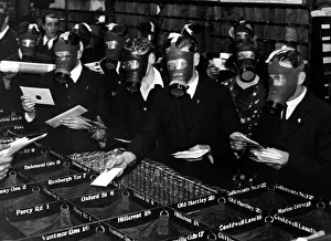 Gas Masks Prints: Whitley Bay Post Officer workers wear gas masks during air raid precaution training