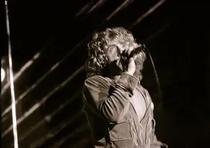 The Who in Concert - May 1976 Roger Daltrey on stage singing at the Charlton