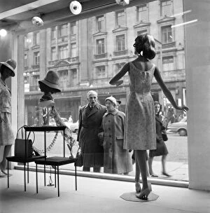 Images Dated 12th November 2015: Whos the dummy? Window shopping in Oxford Street, London. Circa 1960