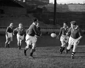 00036 Prints: Wigan players practice passing tactics during training today. October 1957 P012584