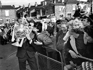 Wigan Rugby F. C. return: Wigan player Ray Ashby is grabbed by an enthusiastic fan 18