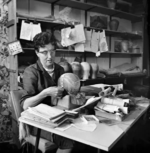 Wigs Prints: Wigmakers Workshop: Women making wigs whilst in another part of the workshop hair is