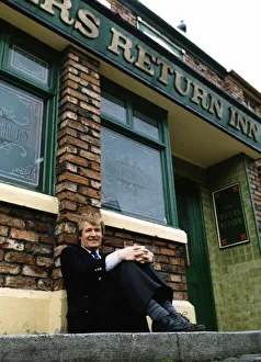 William Roache actor who plays Ken Barlow in tv programme Coronation Street outside pub