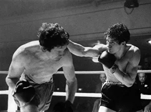 Punch Prints: Willie Hart (left) steps inside a right hand lead from southpaw Jim Swords as the seconds