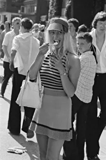 Images Dated 25th June 1976: Wimbledon Tennis Championships. A tennis fan enjoys an ice cream at The Wimbledon