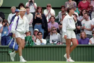 Wimbledon Tennis. J. Capriati and Navratilova walk onto the court. July 1991 91-4197-103