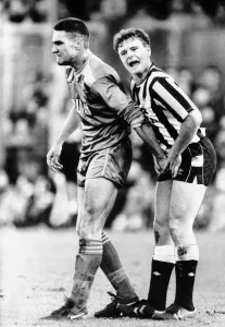 Only Young Men Prints: Wimbledons Vinnie Jones gets to grips with Newcastle United footballer Paul