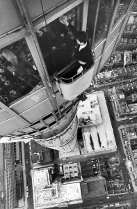 Dangerous Prints: Window cleaner Adrian Rogers in his cradle as he cleans one of the many windows