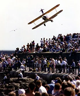00385 Prints: A wing walker performs on the Cadburys Crunchie Boeing-Stearman Model 75 biplane