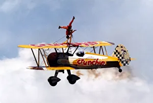 Aerobatics Prints: Wing walker, Tanya Gaze, performs on the Cadburys Crunchie Boeing-Stearman Model 75