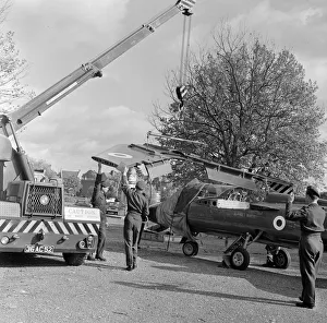 00901 Prints: The wings being attached to a Folland Gnat of the Red Arrows in preparation for a Royal
