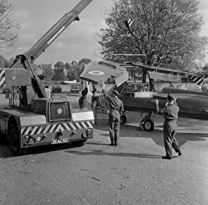00901 Prints: The wings being attached to a Folland Gnat of the Red Arrows in preparation for a Royal