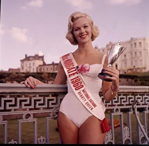 Winner of the Miss Margate beauty pageant posing with trophy at the Winter