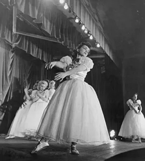 Winnie and Dolly Bennett entertain their fellow war workers at an aircraft factory
