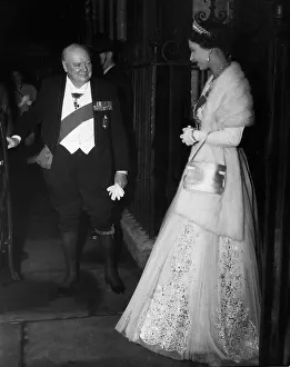 Winston Churchill escorts Queen Elizabeth to her car after dining at no 10 Downing Street