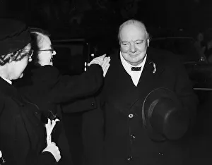 Winston Churchill MP and former WW2 British Prime Minister being congratulated by one of