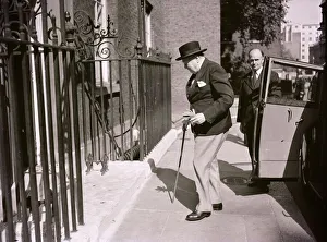 10 Downing Street Prints: Winston Churchill seen here arriving at 10 Downing Street in the summer of July 1952