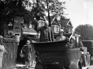 Winston Churchill is seen with his wife Clementine Churchill in an open topped car