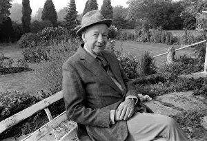 Landscape Prints: Winston Graham author novelist and screen writer October 1985 seated on a bench in his