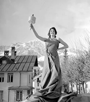 Winter Sports Prints: Winter Olympic Games 1956 Woman posing holding the Olympic Flame