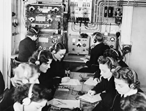 01464 Prints: Wireless Telegraphists in training transcribing messages in Morse code