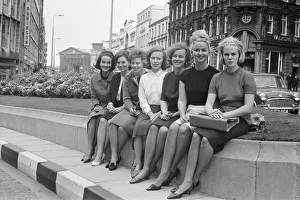 Wives of seven of the players from the Reykjavik football team of Iceland sitting on a