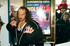 Wolf from Gladiators opening the new Blockbuster Video in Reading. 6th November 1994