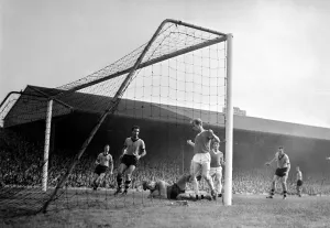 Wolverhampton goalkeeper Sidebottom falls to the ground on the ball in front of