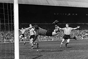 Dive Prints: Wolverhampton Wanderers A dive by Wolves goalkeeper Davies for a shot from Hogson