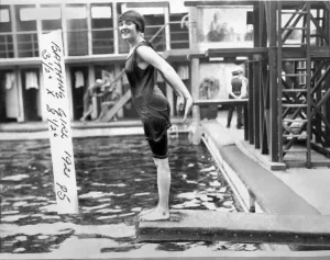 Heat Prints: Woman in a 1920s style swimming costume about to dive in to a swimming pool