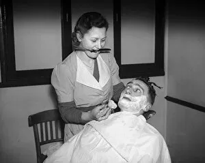 Images Dated 15th September 2015: Woman barber 1941 women doing mens jobs during the war years