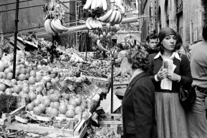Stalls Prints: Woman buying fresh fruit and vegetables in a poor suburb on the outskirts of Rome