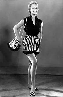 Slippers Prints: Woman dressed up for aday out at the beach, wearing sleveless top and striped skirt